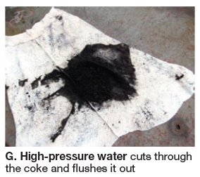 High-pressure water cuts through coke